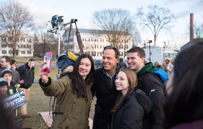 Jake Tapper takes a selfie with students on the Green