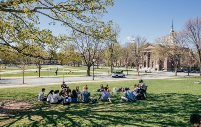 A class sitting outside in a circle