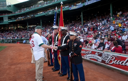 Jim Wright shakes the hands of the servicemen at Fenway Park.