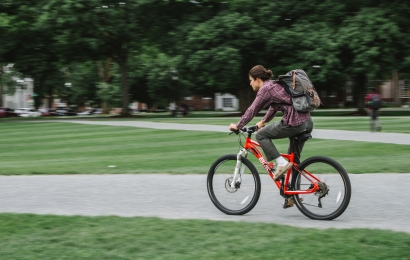 Person cycling on campus