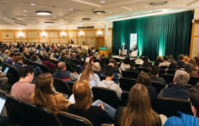 An audience listening to Ben Rhodes talking