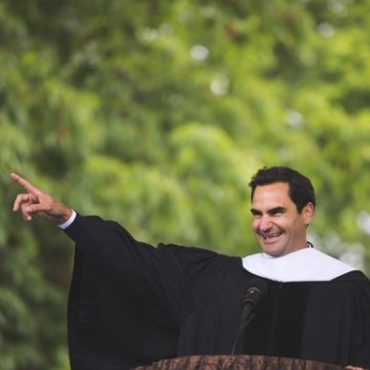 Roger Federer smiling as he gives his commencement speech