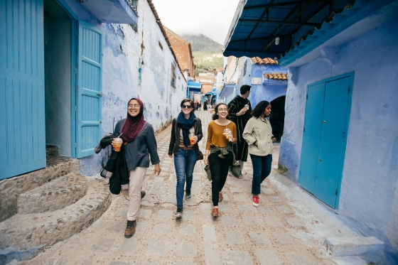 Four students walking down a street in Morocco, Chefchaouen