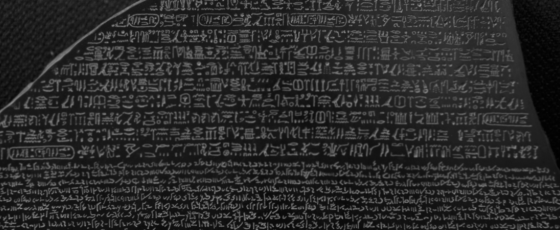Hieroglyphics carved onto a black stone