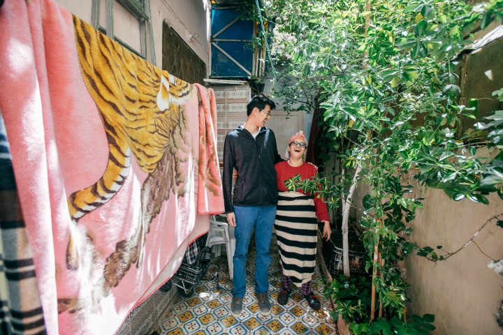 James Park ’20 shares a laugh with his host mother in the courtyard of her home.