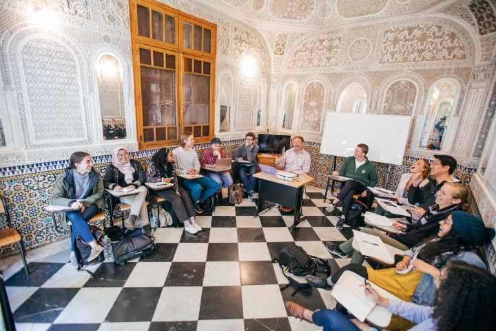 Associate Professor Dirk Vandewalle, center with laptop, teaches a class during the Dartmouth foreign studies program