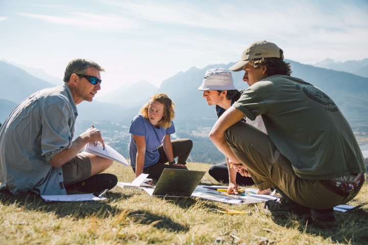 Associate Professor Erich Osterberg, Berit DeGrandpre ’20, Garrett Rawlings ’20, and Connor Haines ’20 look at geological formations above the Bow Valley in Banff.
