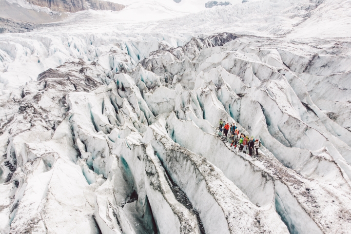 Associate Professor Robert Hawley leads the Stretchies up an icefall, where Athabasca Glacier stretches over a bedrock cliff to form deep crevasses.