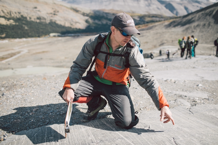 Associate Professor Erich Osterberg points out glacial striations in the forefield of the Athabasca Glacier.