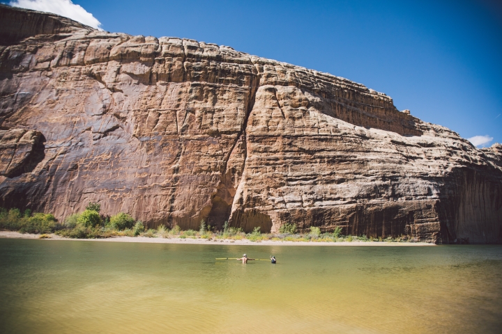 Students measure flow rates while wading chest-high in the Green River in Dinosaur National Monument’s Echo Park.