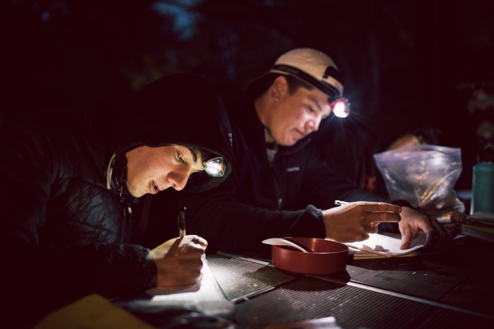 Zach Berkow ’20 and Christian Trejo ’20 doing homework at night in Zion National Park.