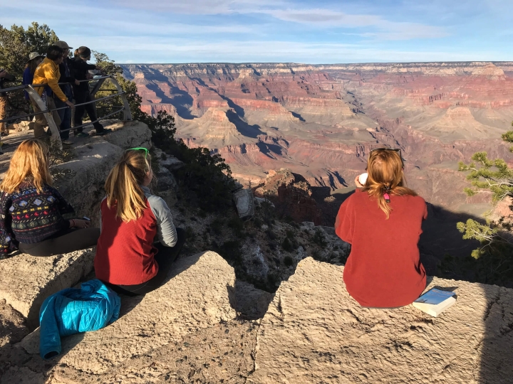 Students sitting on the south rim of the Grand Canyon.
