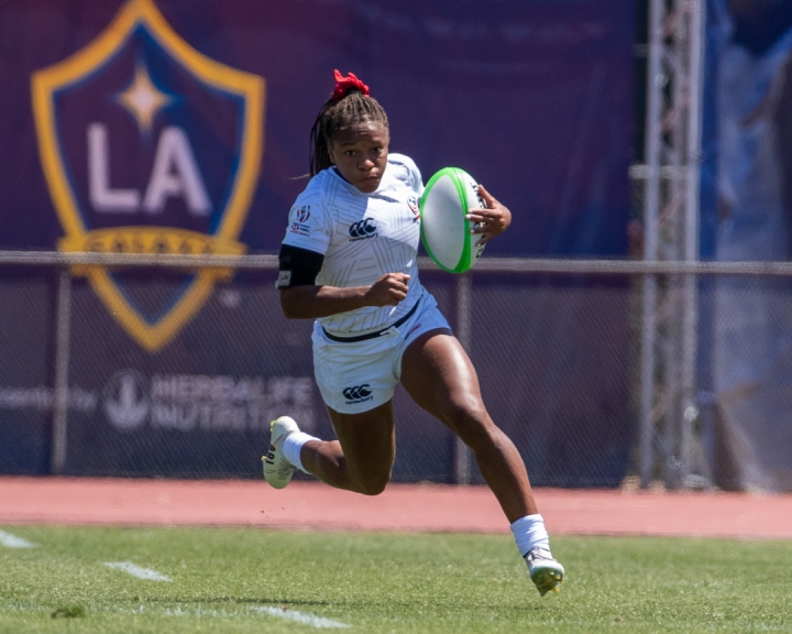 Ariana Ramsey running on the rugby field