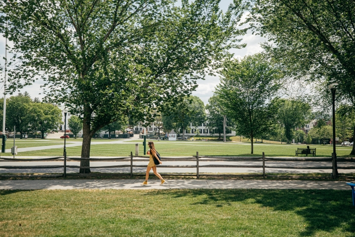 A student walks past the Dartmouth green 
