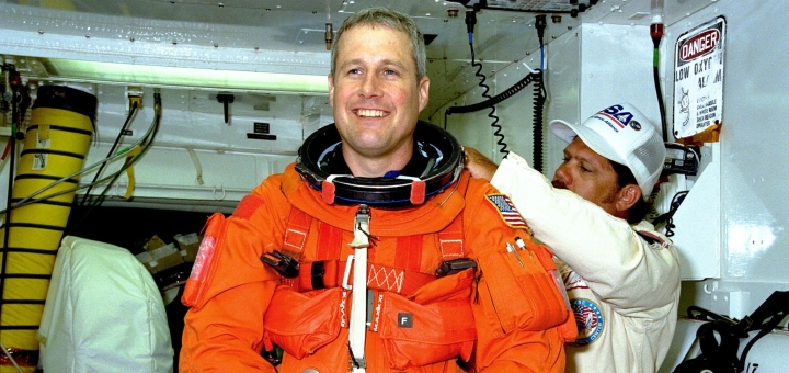 Astronaut Jay Buckey being fitted into his space suit.