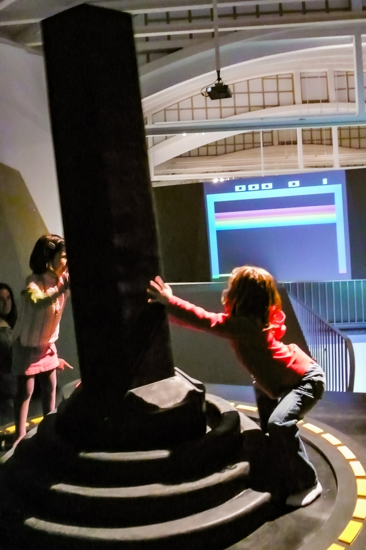 Two girls operate the [giantJoystick]