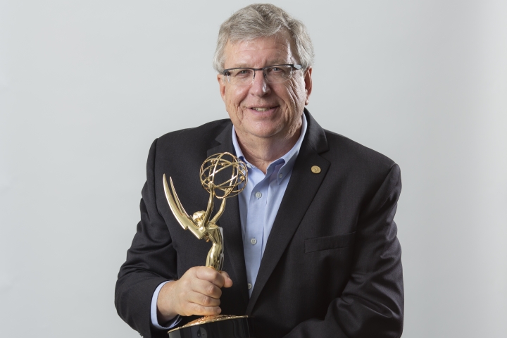 Eric Fossum holds an Emmy