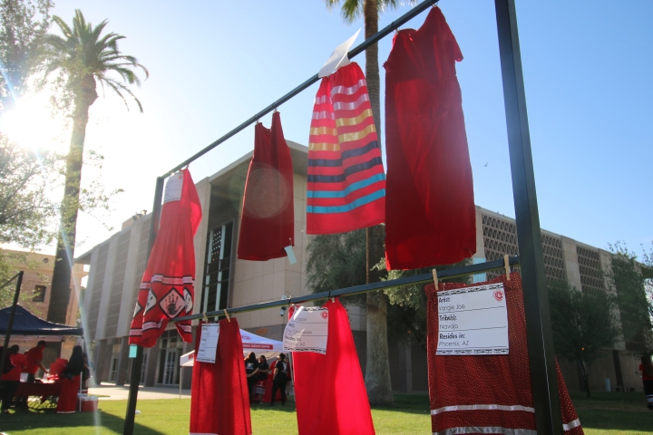 Red skirts hanging from a frame