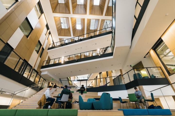 The atrium of the ECSC building with students lounging
