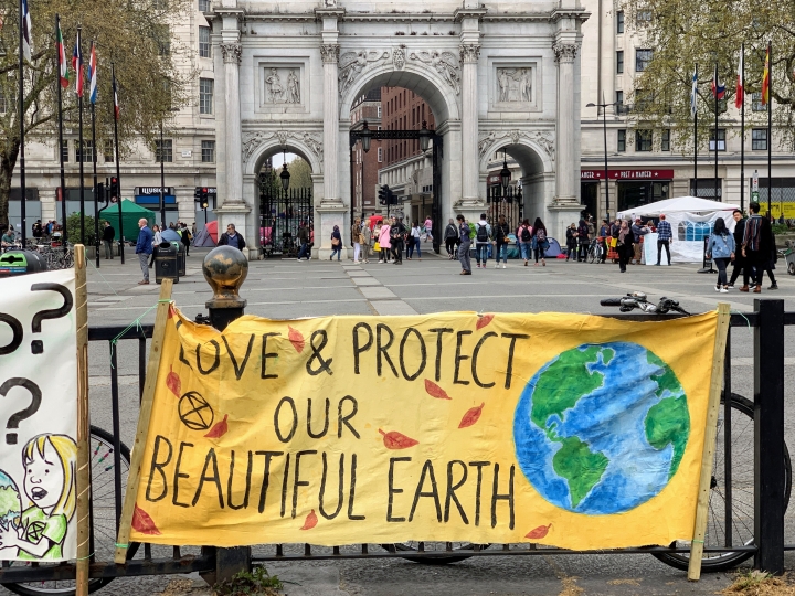 yellow banner that reads love and protect our beautiful earth