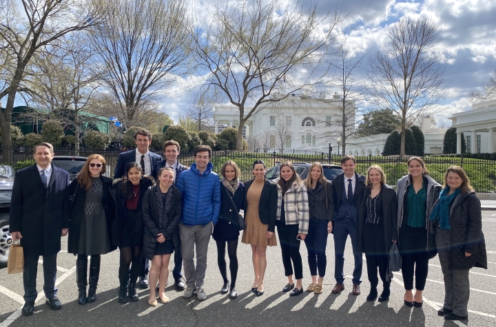 A group of people outside of the White House