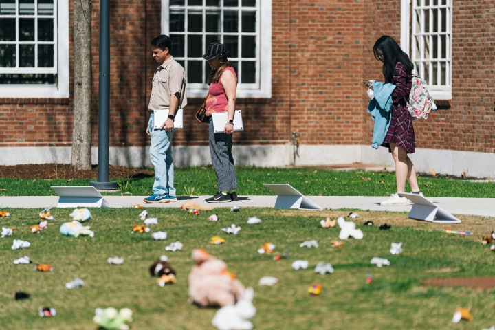 People looking at toys scattered on Baker Lawn