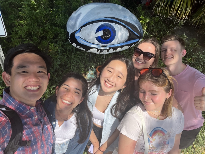 Group of students posing in front of the Dali eye