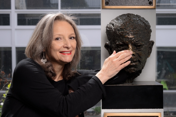 Mary Lou Aleskie with the bust of Warner Bentley in the Hop