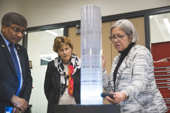 Sethuraman Panchanathan, Jeanne Shaheen, and Mary Albert look at an ice core model
