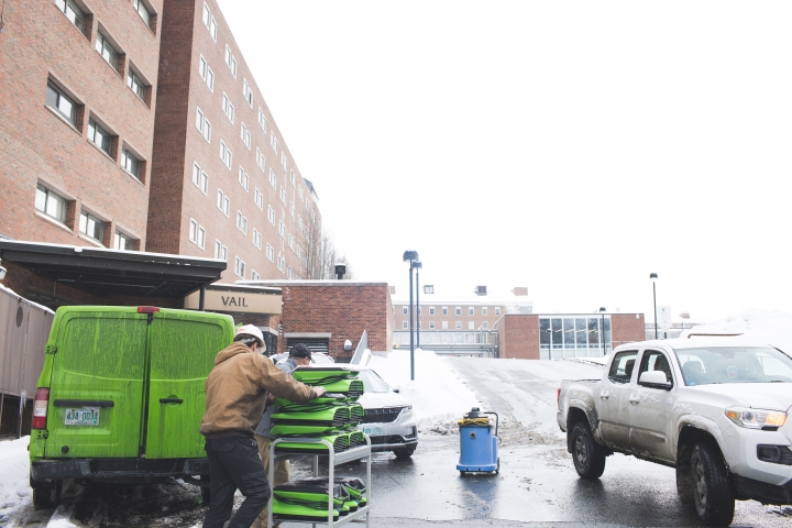 Dartmouth College staff respond to start the cleanup process from a fire