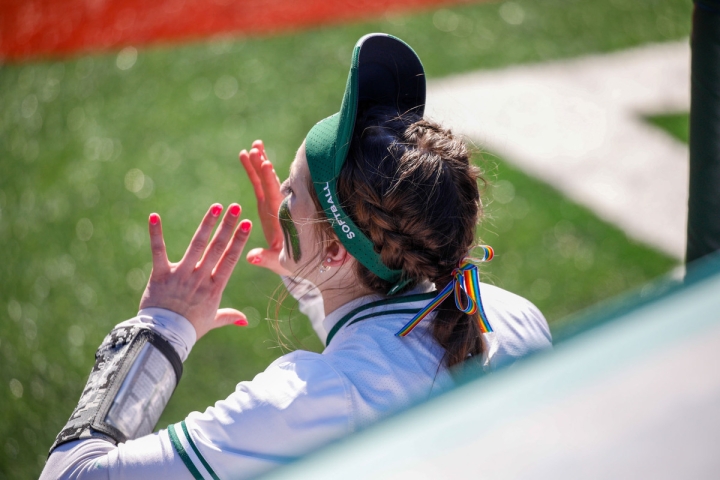 Rainbow ribbon in a softball players hair