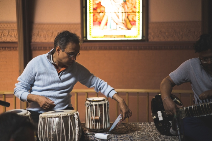 Sandeep Das adjusts a tabla.