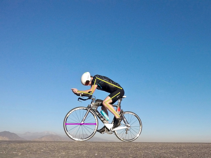 Man on racing bike with measurement lines