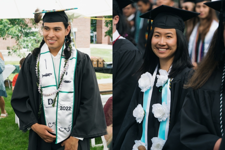Students wearing a Native American stole, and a blue and white flowered stole