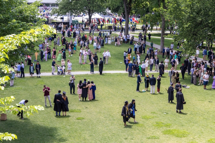 Graduates walk across the green during Dartmouth College Commencement