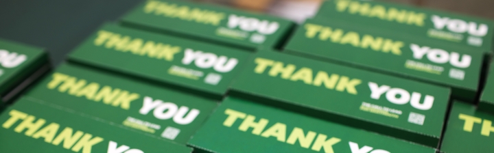 Rows of chocolate bars with thank you written on the packaging