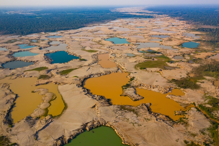 Shallow mining ponds along a river in Madre de Dios, Peru
