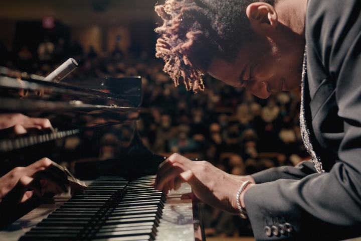 Composer Jon Batiste playing piano in movie &quot;American Symphony&quot;