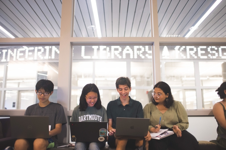 Students work on their laptops in the library