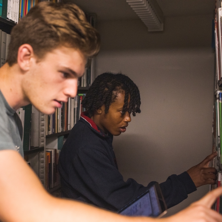Students in the library stacks