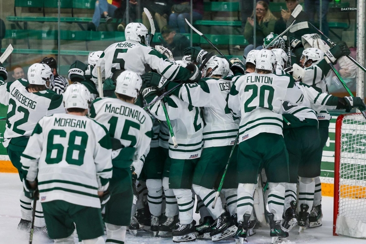 Men's hockey celebrates a win