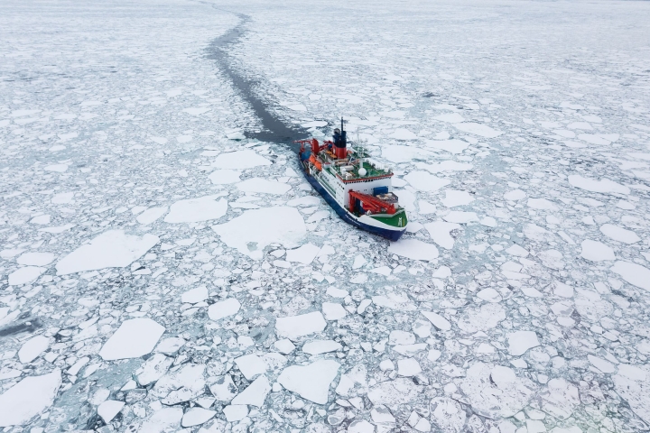 An icebreaker ship sailing through sea ice