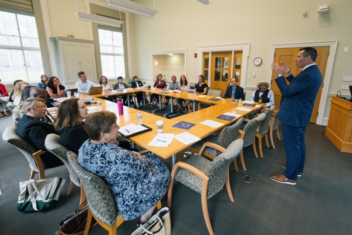 Charles Lloyd speaks with college officials