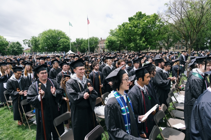 Graduating students clapping