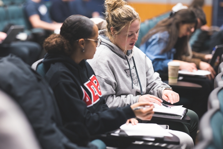 Maya Bryson '25 and Rachel McCarroll '25 work on graphs