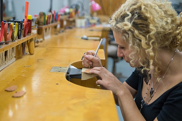 Michelle Berlinger using tools in the jewelry studio