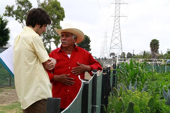 Daniel Susman ’10, left, talking with an urban farmer during his trip across the country.
