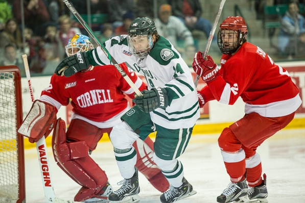 Dartmouth’s Grant Opperman gets past a couple of Cornell hockey players.