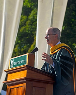 President Hanlon speaking at a lecturn