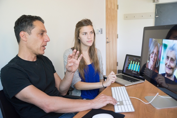 Olivia Holmes with her adviser, Professor Hany Farid at a computer